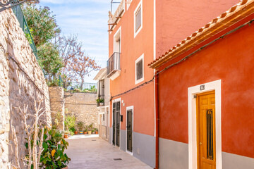 Fototapeta premium View to beautiful Villajoyosa street with multi-colored houses. Villajoyosa - coastal town in Alicante Province, Valencian Community, Spain, by Mediterranean Sea