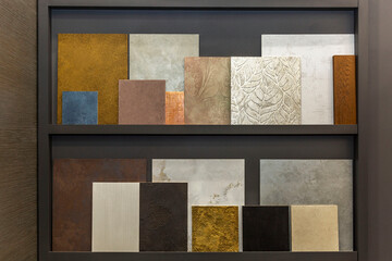Samples of finishing materials on the shelf. Modern trends in decorating and interior design. Front view.