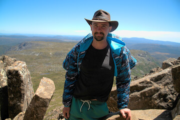 Fototapeta premium The traveler went up the mountain. This is the beauty of the mountains. This is mountain climbing. Australia. Tasmania. This is an encounter with wildlife. 