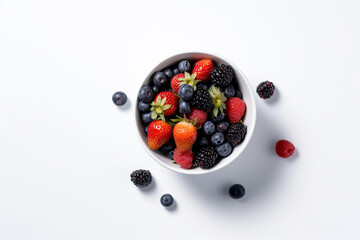 White cup with strawberries, raspberries, blackberries, blueberries on a white background. Top view, berries flat lay. Natural ingredients.