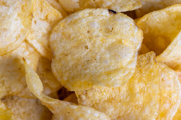 thin potato chips with spices, close up