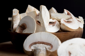 Fototapeta na wymiar Sliced mushrooms on a board