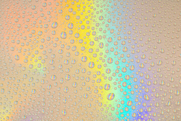 Blurred defocused abstract iridescent foil wallpaper texture. Holographic soft pastel colors...