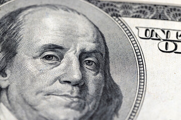 portrait of the president on American hundred dollar bills