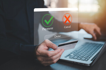 Laptop with Online payment ,Hand touch banking online bill payment Approved concept button, credit card and network connection icon on business technology virtual screen background