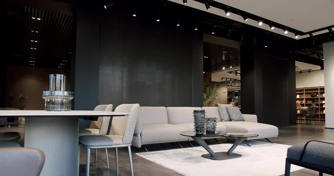 Modern contemporary Minimalist living room with beige and white furniture. Luxury Modern House Interior With Corner Sofa, Dining table with chairs. Fashionable furniture. Minimalist Home Interior.