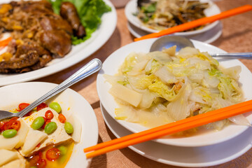 Chinese style stinky tofu with lots of others dishes in restaurant