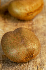 Whole ripe kiwi on the table