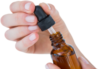 Woman holding bottle of medicine