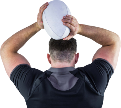 Tough rugby player throwing ball