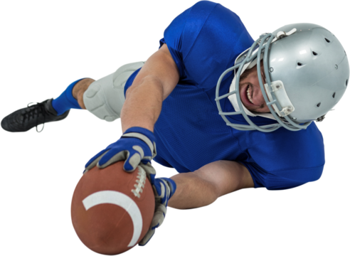 Full length of American football player reaching ball