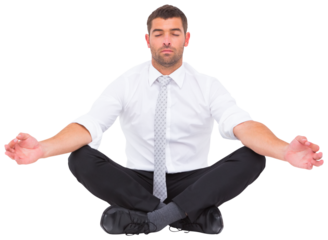 Businessman meditating in lotus pose