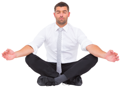 Businessman meditating in lotus pose