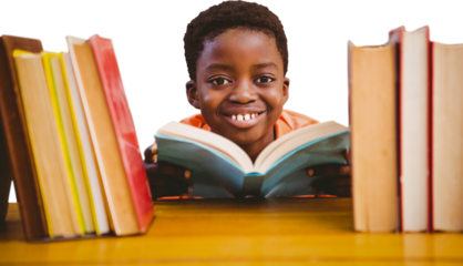 Cute boy reading book in library