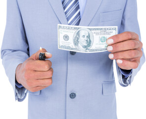 Businessman burning dollar banknote on white background