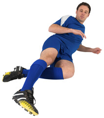 Football player in blue kicking