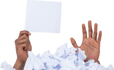 Heap of crumpled paper with hand holding blank page