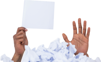 Heap of crumpled paper with hand holding blank page