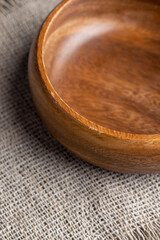 an old empty wooden bowl on the table