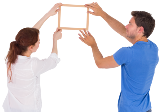 Couple deciding to hang picture