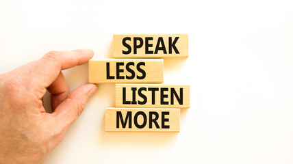 Speak less listen more symbol. Concept words Speak less listen more on wooden block. Beautiful...