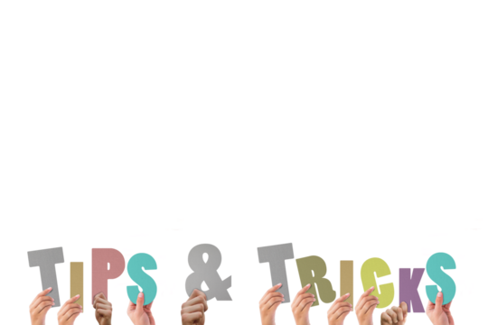 Cropped hands holding colorful alphabets forming tips and tricks - Powered by Adobe