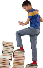 Schoolboy climbing stack of book