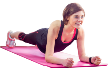 Sporty woman doing plank on exercise mat