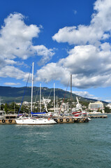 Fototapeta na wymiar Boats and yachts at the marina in Yalta