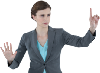 Businesswoman with arms raised while using invisible digital screen