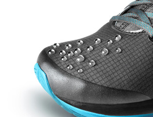 Raindrops on the surface of sports shoes on a white background