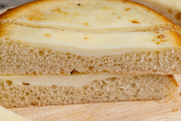 Cut into pieces round bun with creamy sour cream filling