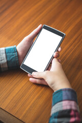 Cropped image of person holding smart phone