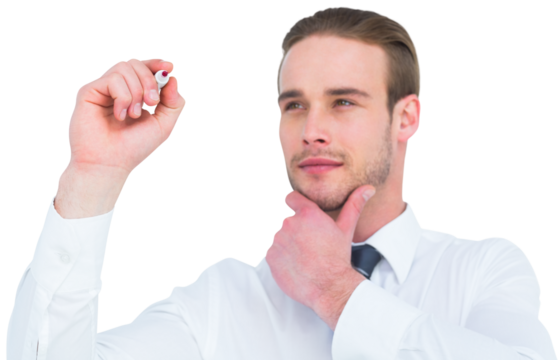 Focused businessman writing with hand on chin