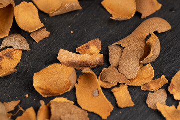 the shell of the peeled tamarind fruit on the table