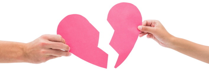 Hands holding two halves of broken heart