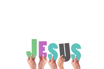 Cropped hands holding colorful word Jesus 