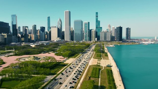 Aerial view Downtown Chicago and Lake Michigan on a sunny day. Vehicle traffic per day moving along the highway