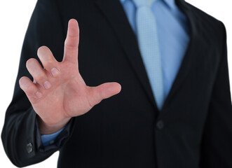 Obraz premium Mid section of businessman touching imaginary interface screen