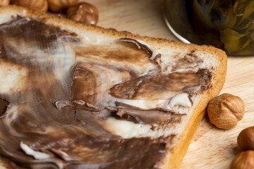 slices of bread with chocolate butter on the table