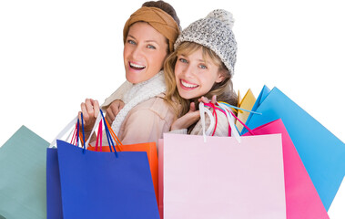 Beautiful women holding shopping bags looking at camera 