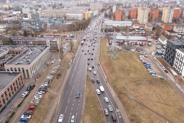 Drone photography of traffic jam in the middle of city during spring morning.