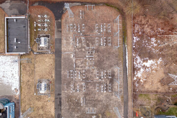 Drone photography of electrical sub station in a city plot during spring morning.