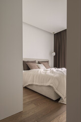 Modern minimalistic bedroom interior design in brown and white shades