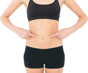 Closeup mid section of a fit woman with hands on stomach - Powered by Adobe
