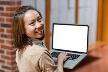 Happy young woman using laptop at college