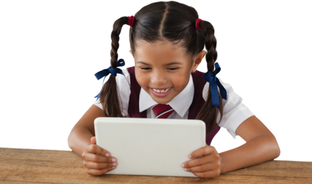Schoolgirl using digital tablet at desk