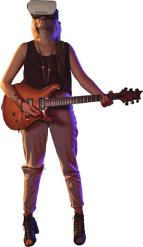 Young woman playing guitar while wearing virtual reality simulator