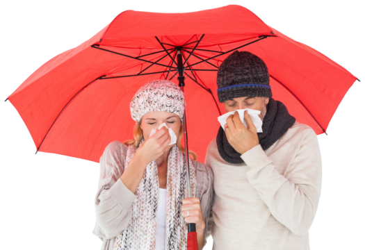 Ill couple sneezing in tissue while standing under umbrella