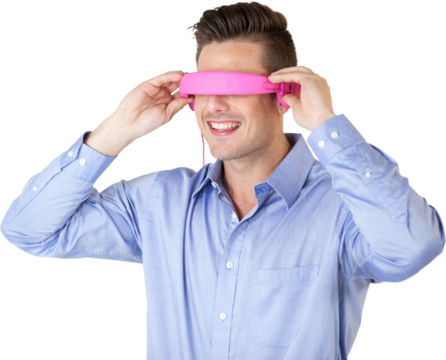 Smiling young man gesturing while using virtual reality glasses